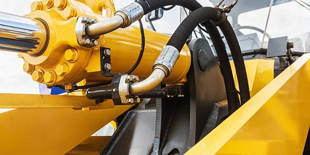 hydraulics tractor yellow. focus on the hydraulic pipes